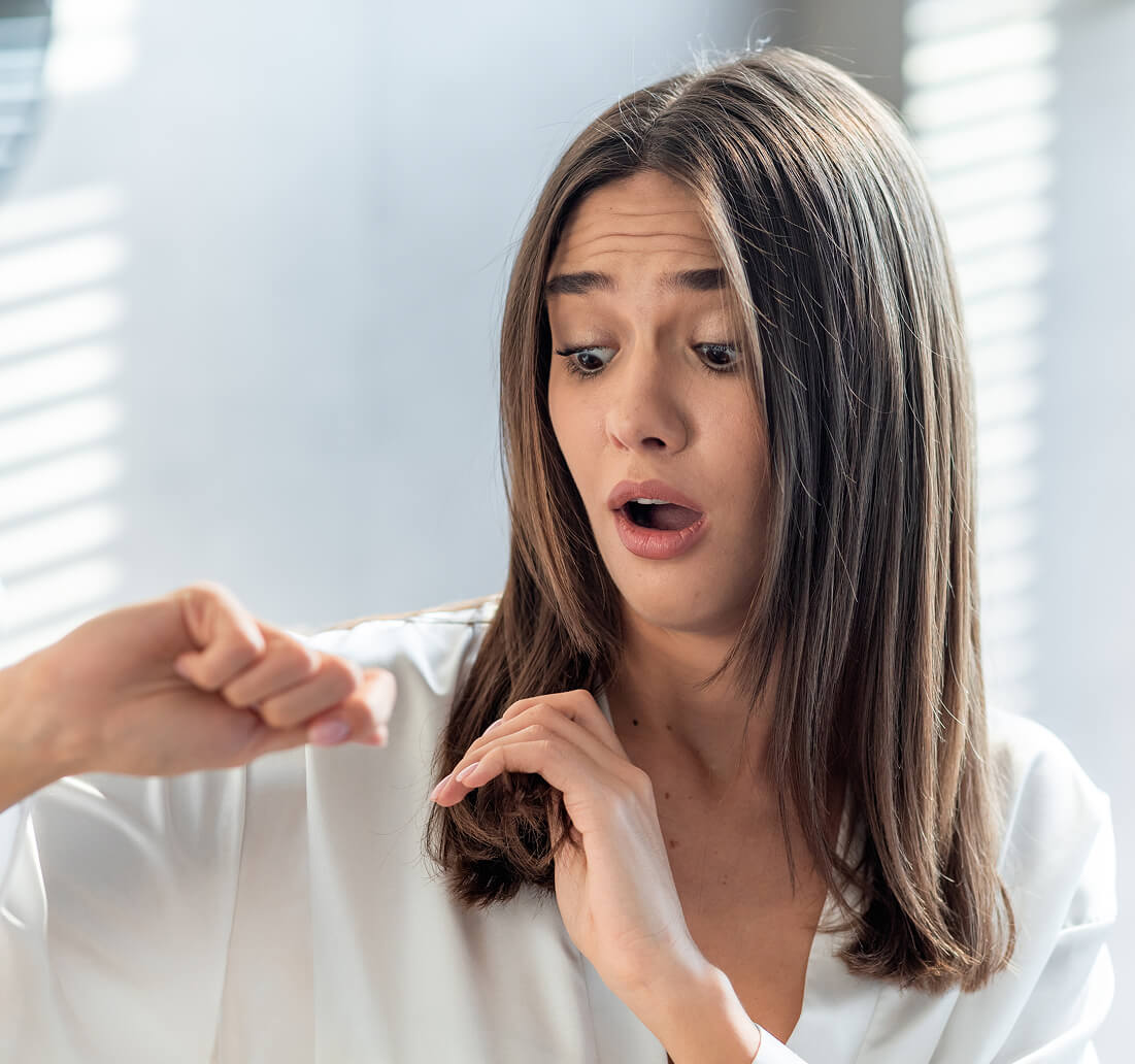 shocked-woman-looking-at-her-dry-brittle-hair-whil-2023-11-27-05-09-34-utc 1 (1)